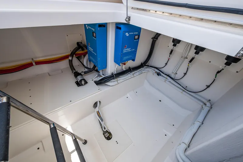 Slide: The Image of 2024 Tiara Yachts 38 LS engine compartment with electrical systems and wiring. - 42