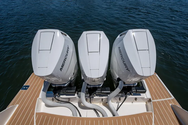 Slide: The Image of 2024 Tiara Yachts 38 LS with triple Mercury outboard engines on water. - 44