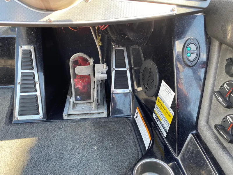 Slide: The Image of 2017 Ranger Z520C Comanche boat foot pedal controls and dashboard details. - 10