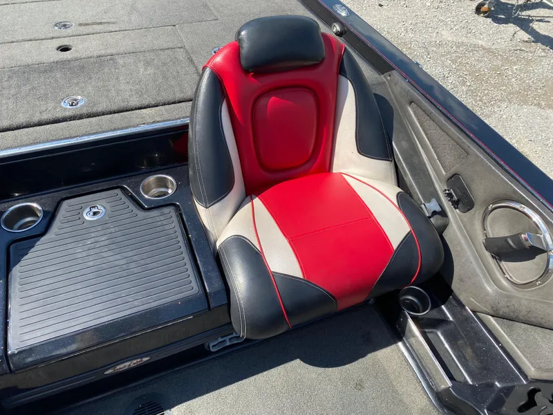 Slide: The Image of 2017 Ranger Z520C Comanche boat seat, red and black design, with cup holders and storage. - 16
