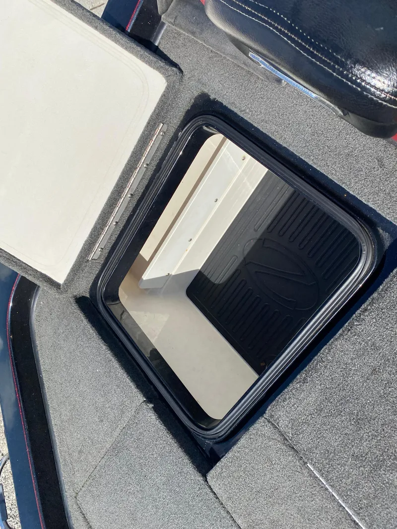 Slide: The Image of 2017 Ranger Z520C Comanche storage compartment with open lid, showcasing interior space. - 22