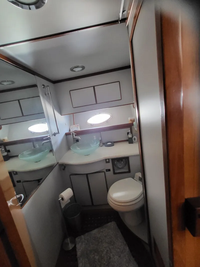 Slide: The Image of Bathroom interior of 1997 McKinna 48' Pilot House yacht with modern fixtures. - 14