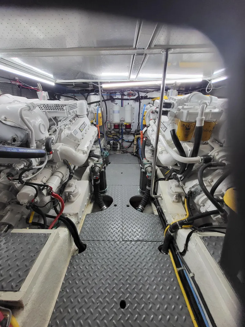 Slide: The Image of Engine room of 1997 McKinna 48' Pilot House with dual engines and equipment. - 29