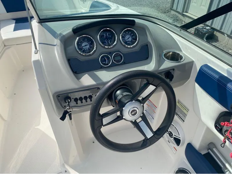 Slide: The Image of Steering console of 2018 Chaparral 21 H2O Sport boat with gauges and controls. - 10