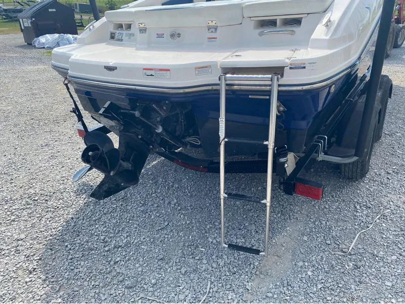 Slide: The Image of Rear view of 2018 Chaparral 21 H2O Sport boat with ladder and propeller. - 11