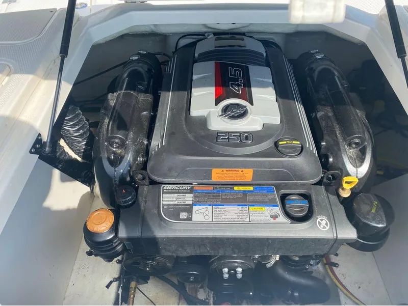 Slide: The Image of Engine of a 2018 Chaparral 21 H2O Sport boat, featuring a Mercury 4.5L 250 HP. - 13
