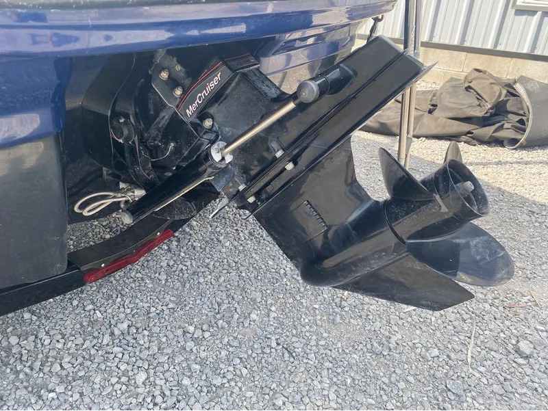 Slide: The Image of 2018 Chaparral 21 H2O Sport boat with MerCruiser outdrive on gravel surface. - 6