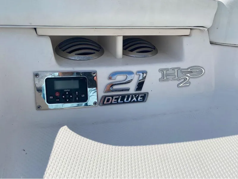 Slide: The Image of 2018 Chaparral 21 H2O Sport boat dashboard with control panel and speaker. - 9