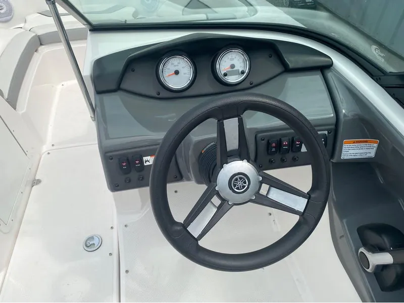 Slide: The Image of 2017 Yamaha Boats SX190 dashboard with steering wheel and gauges. - 10