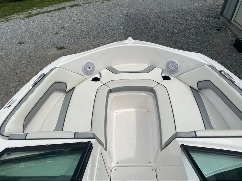 Slide: The Image of 2017 Yamaha Boats SX190 interior with white cushioned seating and speakers. - 5