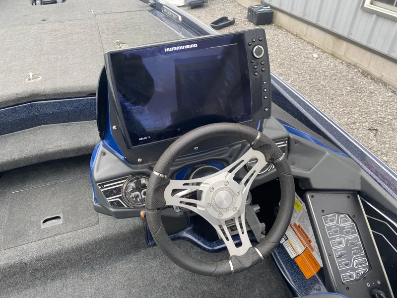 Slide: The Image of 2020 Skeeter FXR20 Limited boat dashboard with Humminbird display and steering wheel. - 10