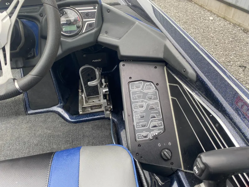Slide: The Image of 2020 Skeeter FXR20 Limited boat dashboard with steering wheel and control panel. - 11