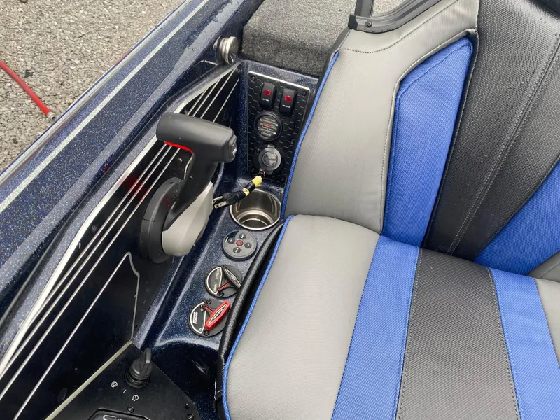 Slide: The Image of 2020 Skeeter FXR20 Limited boat interior with blue and gray seating and control panel. - 17