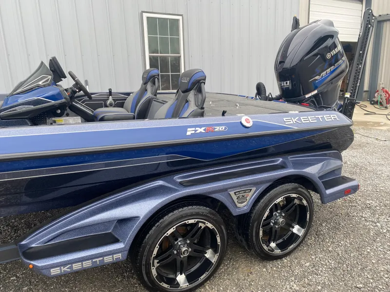 Slide: The Image of 2020 Skeeter FXR20 Limited boat with Yamaha engine, parked on a trailer. - 7