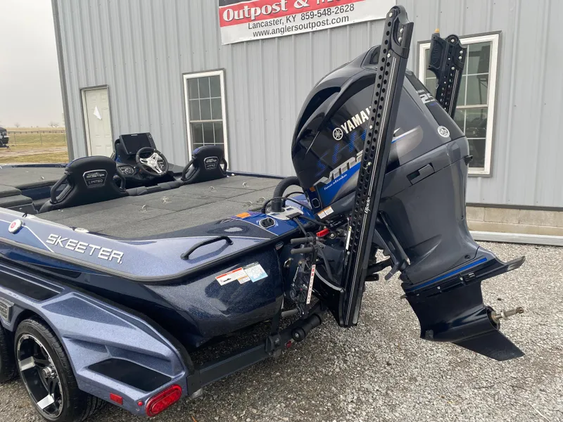Slide: The Image of 2020 Skeeter FXR20 Limited boat with Yamaha engine, parked outside a building. - 8