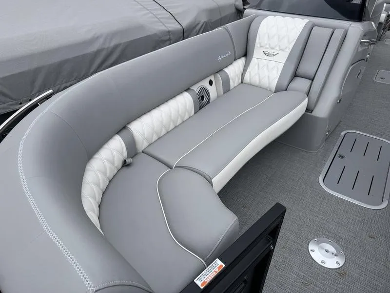 Slide: The Image of Luxurious seating on 2025 Bennington 25 QFBA boat, featuring elegant gray and white upholstery. - 10