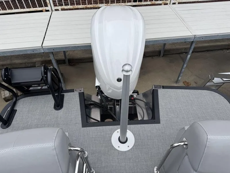 Slide: The Image of 2025 Bennington 25 QFBA boat deck with motor and seating area. - 5