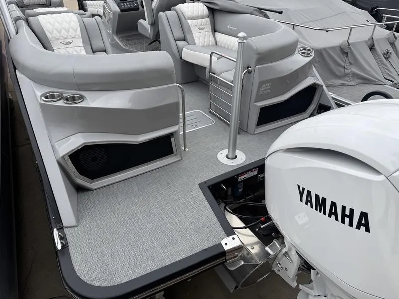 Slide: The Image of 2025 Bennington 25 QFBA pontoon boat with Yamaha outboard motor, featuring luxurious seating. - 6