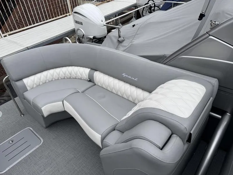 Slide: The Image of Luxurious seating on 2025 Bennington 25 QFBA boat with Yamaha engine in background. - 9