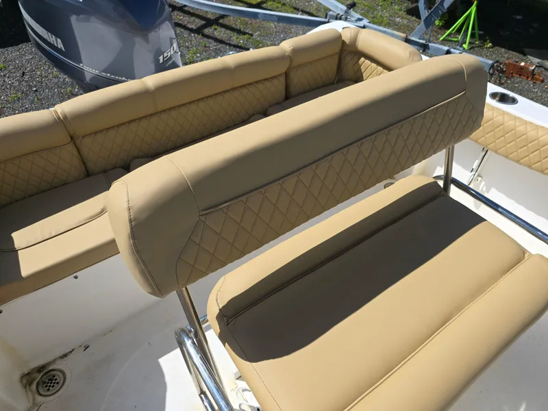 Slide: The Image of Tan leather seating on a 2016 Tidewater 210 LXF boat, featuring diamond stitching. - 15