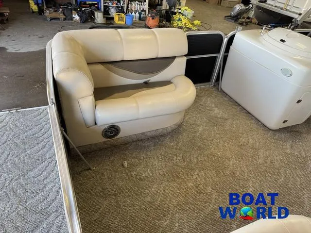 Slide: The Image of 2008 South Bay 20' Cruise Pontoon interior with beige seating and carpeted floor. - 10