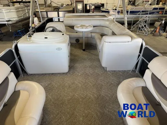 Slide: The Image of 2008 South Bay 20' Cruise Pontoon with Mercury 60HP, spacious seating, and table in showroom. - 12