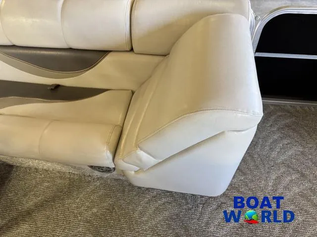 Slide: The Image of 2008 South Bay 20' Cruise Pontoon interior seating, beige upholstery, carpeted floor, Boat World logo. - 15