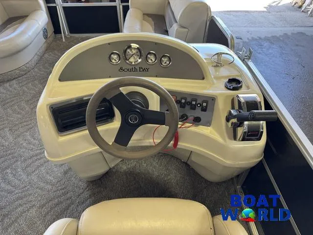 Slide: The Image of 2008 South Bay 20' Cruise Pontoon dashboard with steering wheel and controls. - 27