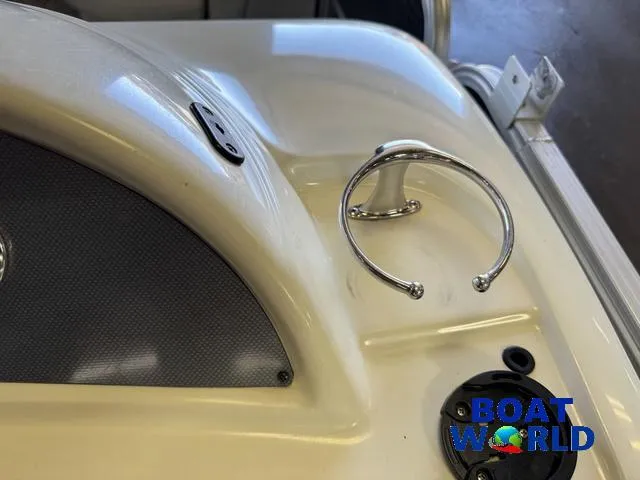 Slide: The Image of 2008 South Bay pontoon boat dashboard with cup holder and control panel. - 31