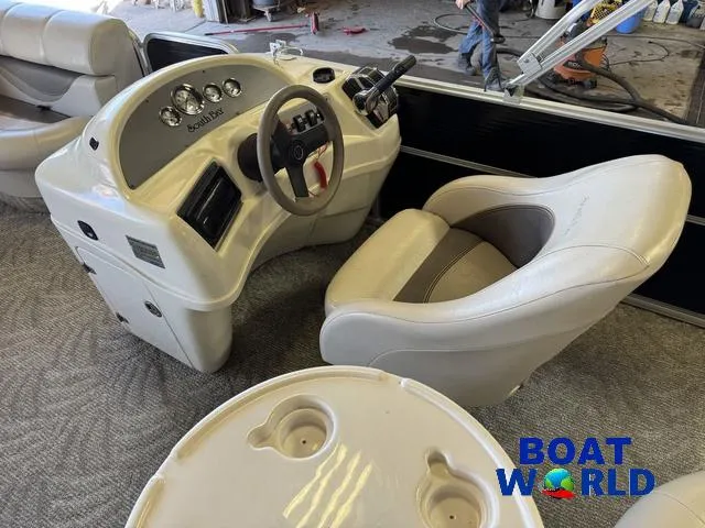Slide: The Image of 2008 South Bay 20' Cruise Pontoon interior with steering console and seating. - 36