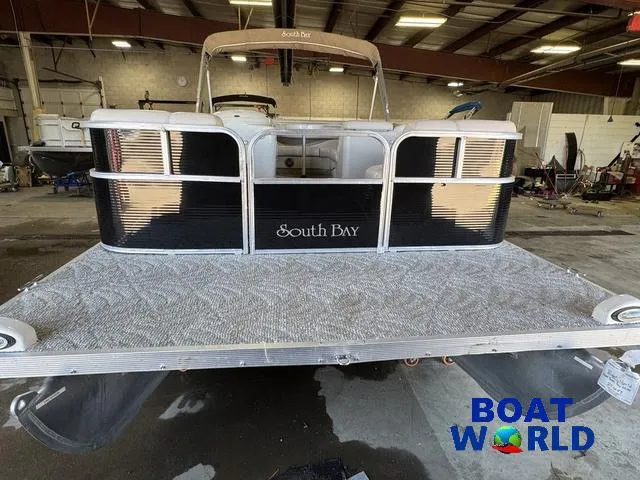 Slide: The Image of 2008 South Bay 20' Cruise Pontoon with Mercury 60HP engine in a warehouse setting. - 37