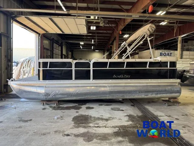 Slide: The Image of 2008 South Bay 20' Cruise Pontoon with Mercury 60HP engine in a warehouse. - 39