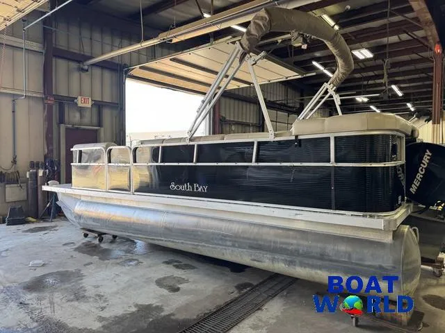 Slide: The Image of 2008 South Bay 20' Cruise Pontoon with Mercury 60HP engine in a warehouse. - 41