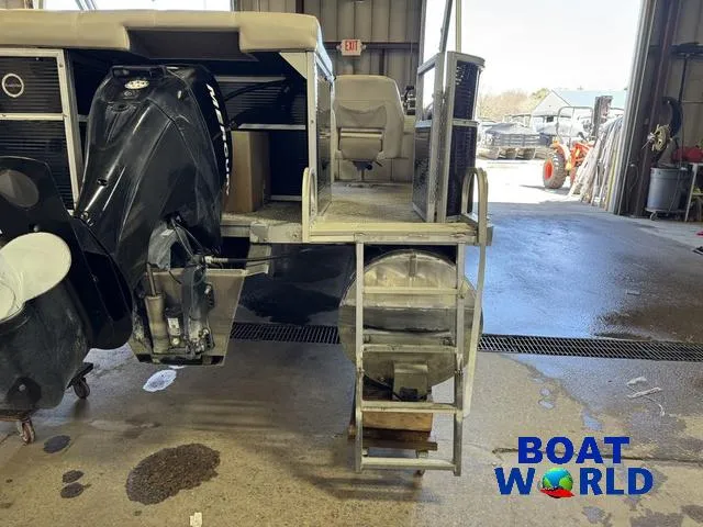 Slide: The Image of 2008 South Bay 20' Cruise Pontoon with Mercury 60HP engine in a garage setting. - 45