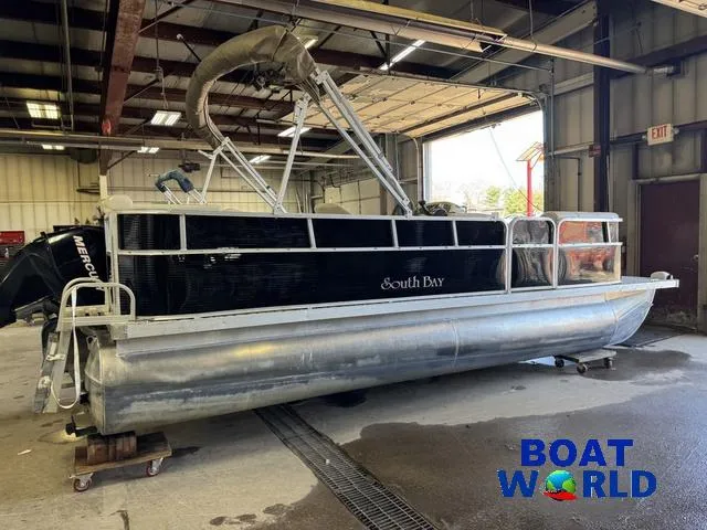 Slide: The Image of 2008 South Bay 20' Cruise Pontoon with Mercury 60HP engine in a warehouse. - 47