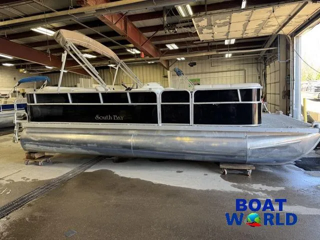 Slide: The Image of 2008 South Bay 20' Cruise Pontoon with Mercury 60HP engine in a warehouse. - 49