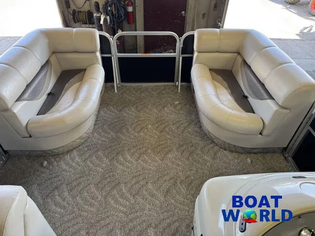 Slide: The Image of 2008 South Bay 20' Cruise Pontoon interior with plush seating and carpeted floor. - 5