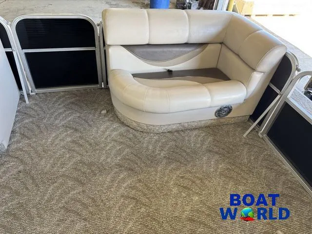 Slide: The Image of 2008 South Bay 20' Cruise Pontoon interior with beige seating and carpeted floor. - 8