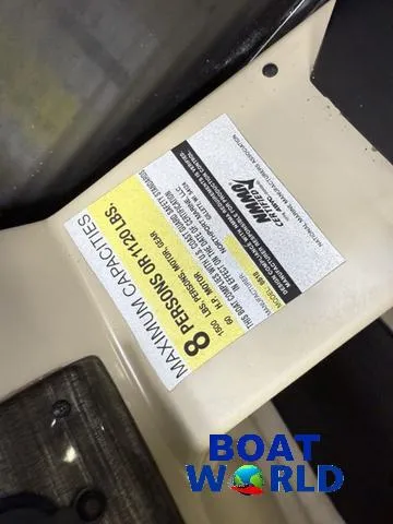 Slide: The Image of Montego Bay 8518 Cruise boat capacity label, 8 persons or 1210 lbs, Boat World logo. - 11