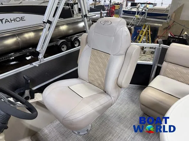 Slide: The Image of 2019 Montego Bay 8518 Cruise boat interior with plush seating and steering wheel. - 8