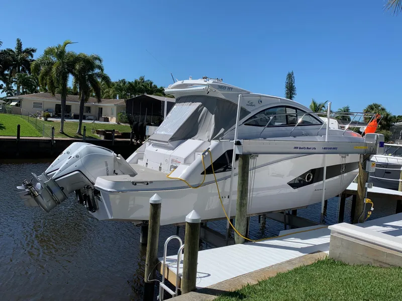 Slide: The Image of Evolve 360HT 2022 boat docked in sunny canal setting. - 15