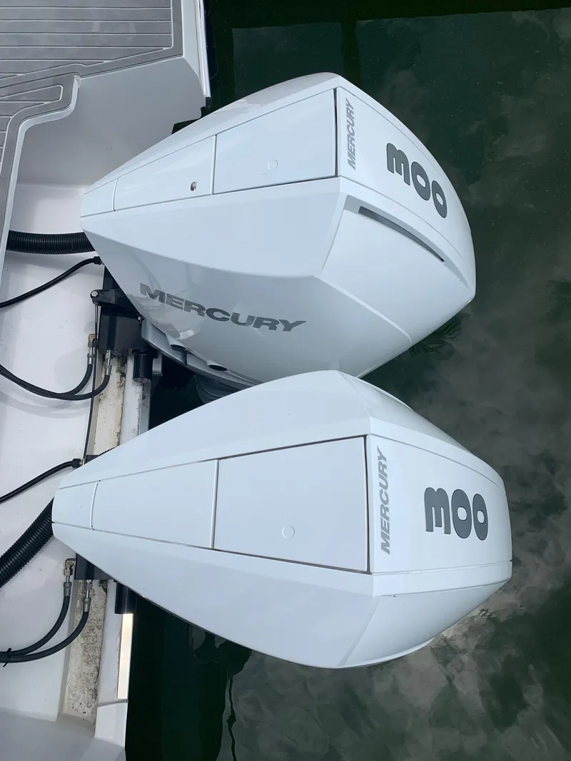 Slide: The Image of Twin Mercury outboard engines on a 2022 Evolve 360HT boat. - 3