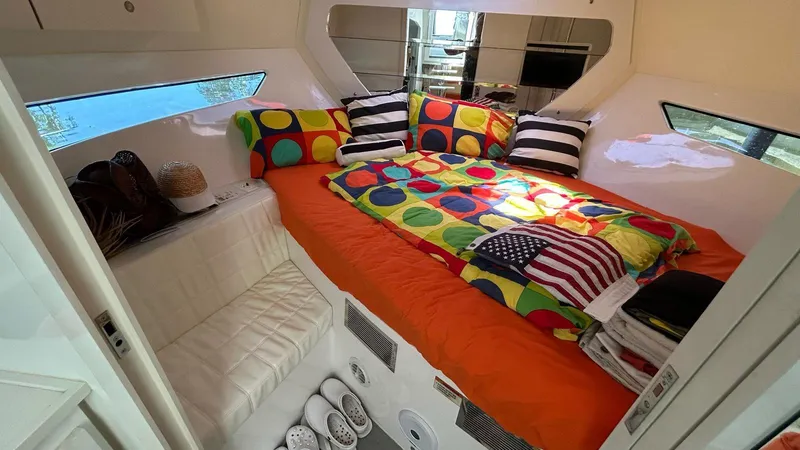 Slide: The Image of Cozy cabin interior of 2022 Evolve 360HT with colorful bedding and modern decor. - 36
