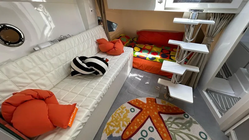 Slide: The Image of Interior of 2022 Evolve 360HT yacht with modern seating and colorful decor. - 37