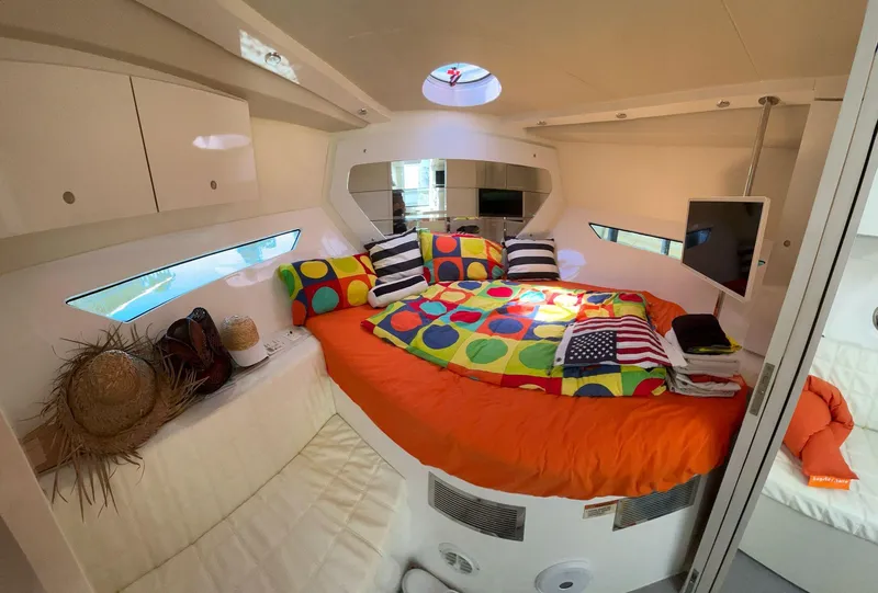 Slide: The Image of Cozy cabin interior of 2022 Evolve 360HT with colorful bedding and modern amenities. - 45