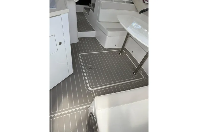 Slide: The Image of Interior of 2022 Evolve 360HT boat with sleek seating and modern flooring. - 51
