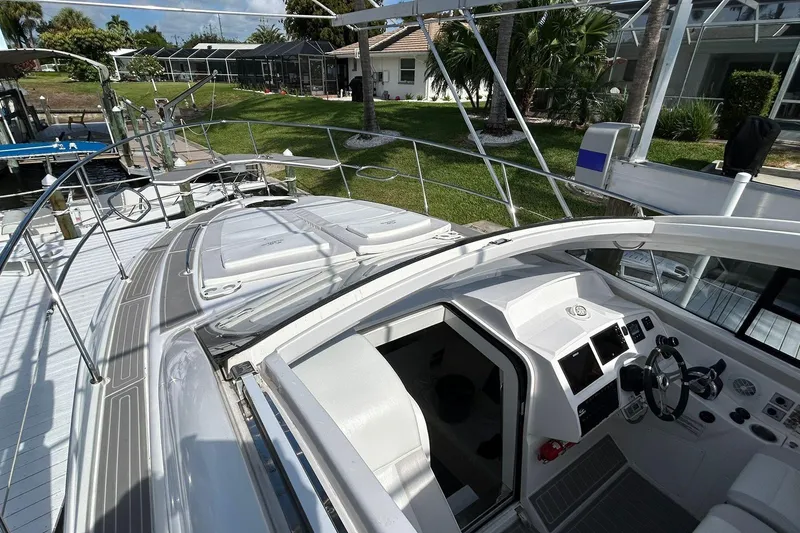 Slide: The Image of 2021 Evolve 360HT yacht cockpit with modern controls and spacious deck. - 63