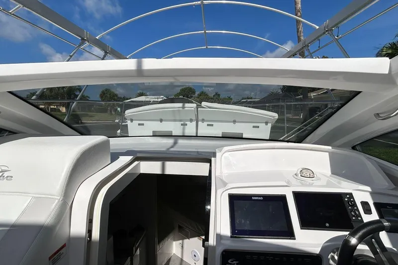 Slide: The Image of Cockpit view of 2021 Evolve 360HT boat with modern navigation system. - 66