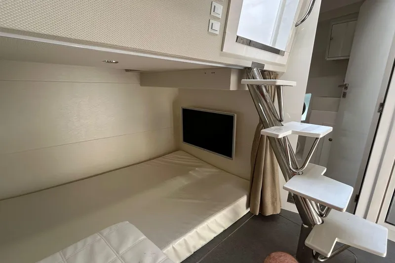 Slide: The Image of Modern interior of 2021 Evolve 360HT with sleek bunk bed and compact TV setup. - 70
