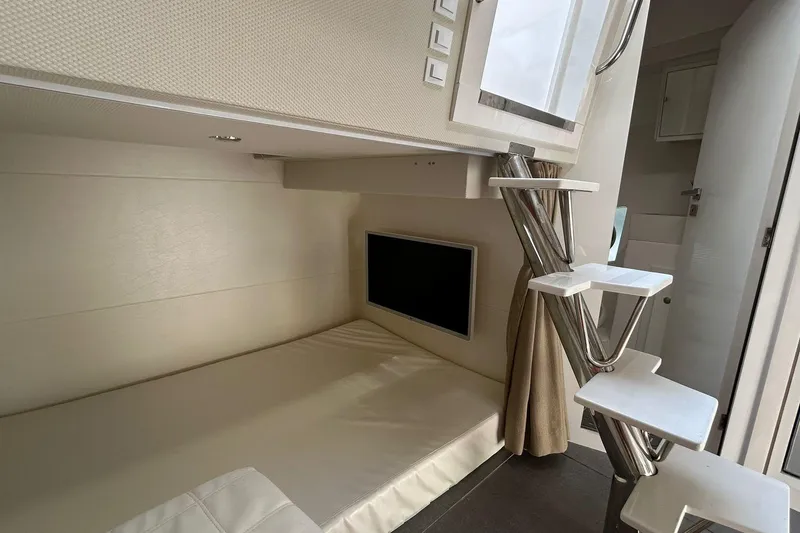 Slide: The Image of Modern interior of 2021 Evolve 360HT with compact bed and sleek staircase design. - 71